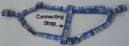 Plaid Harness laid flat showing connecting strap