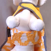 You can see the tummy strap on the Reversible Raincoat for little dogs.